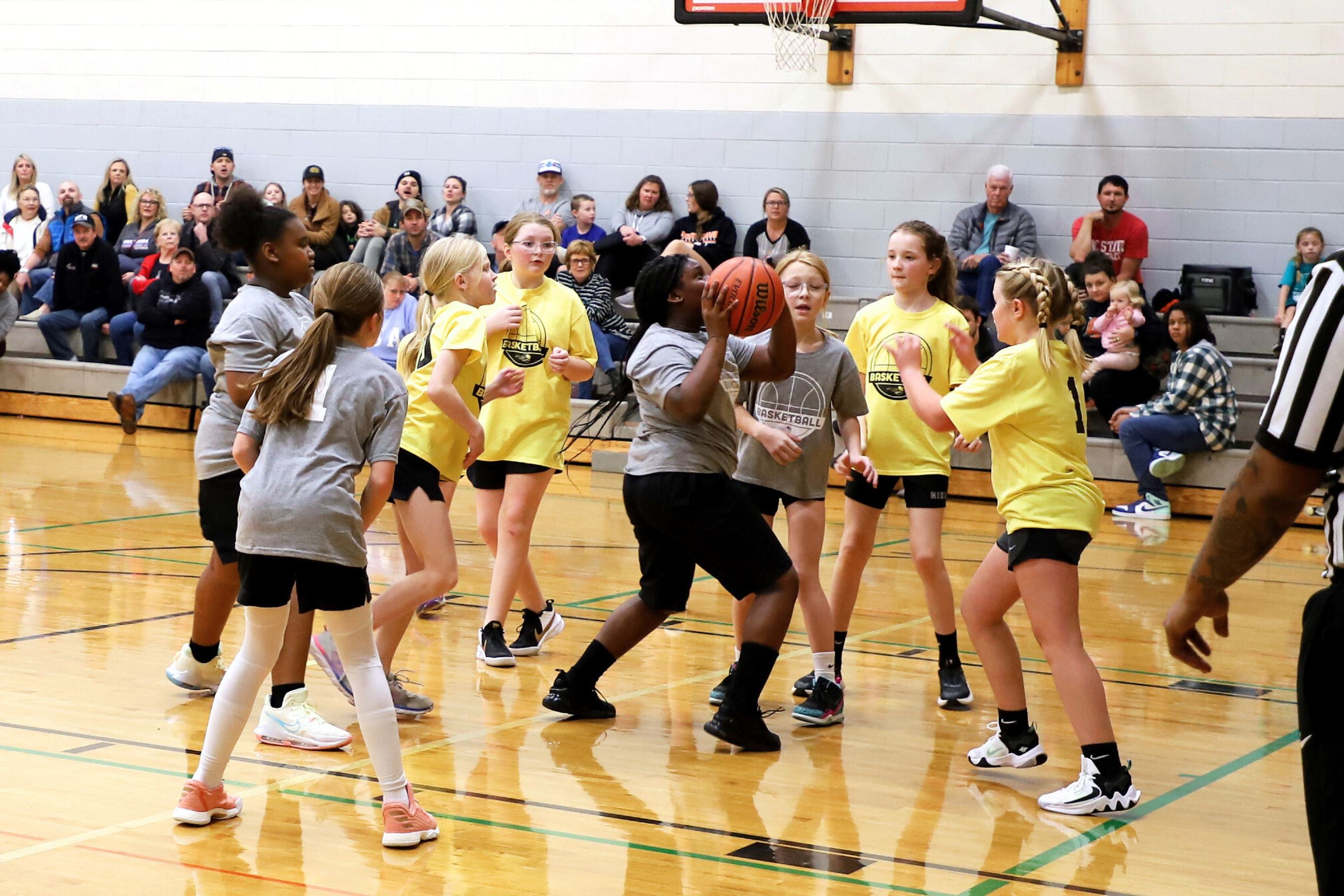 youth girls basketball game in gym