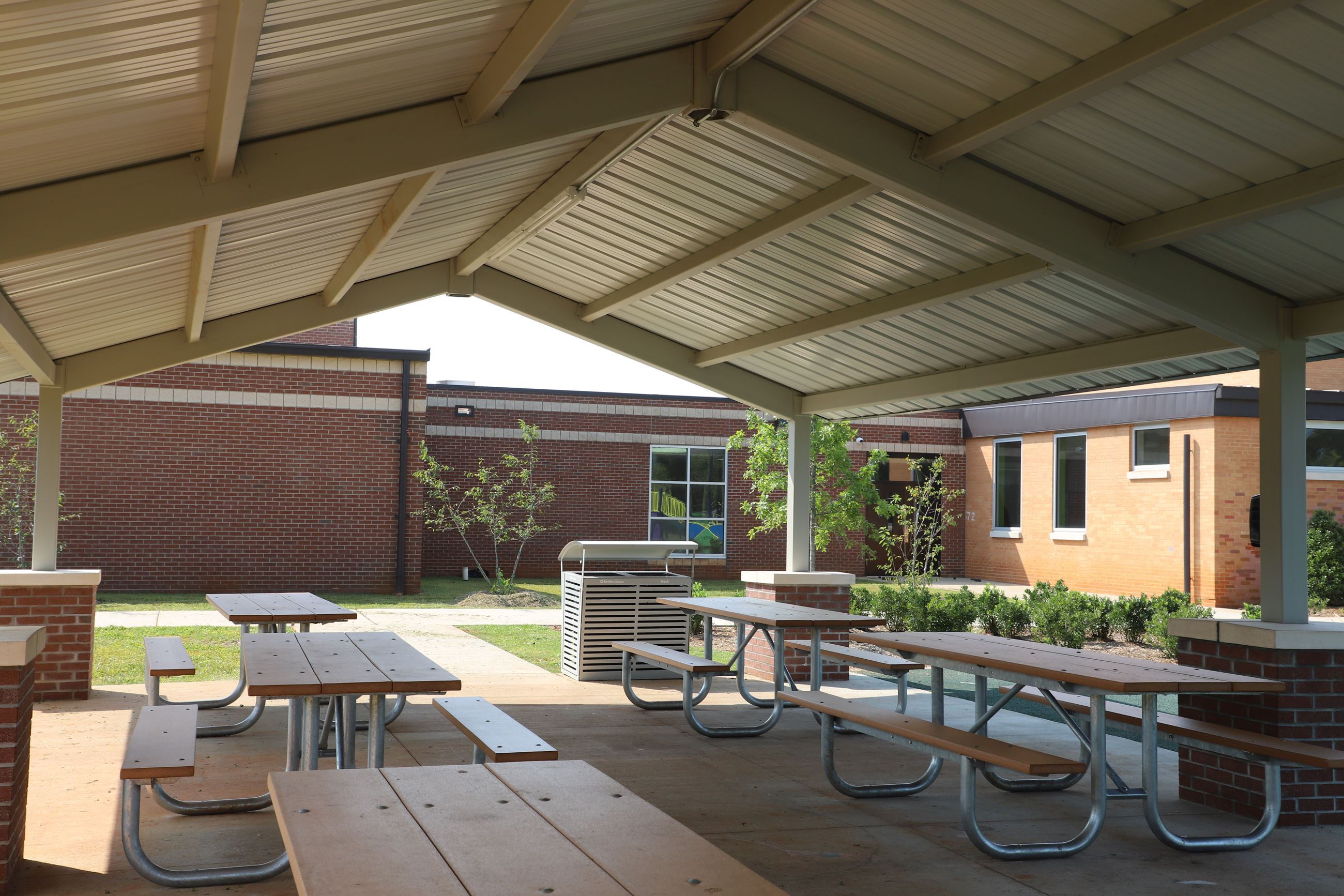 Large outdoor shelter with picnic tables